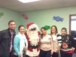 BSS staff posing with blind Santa